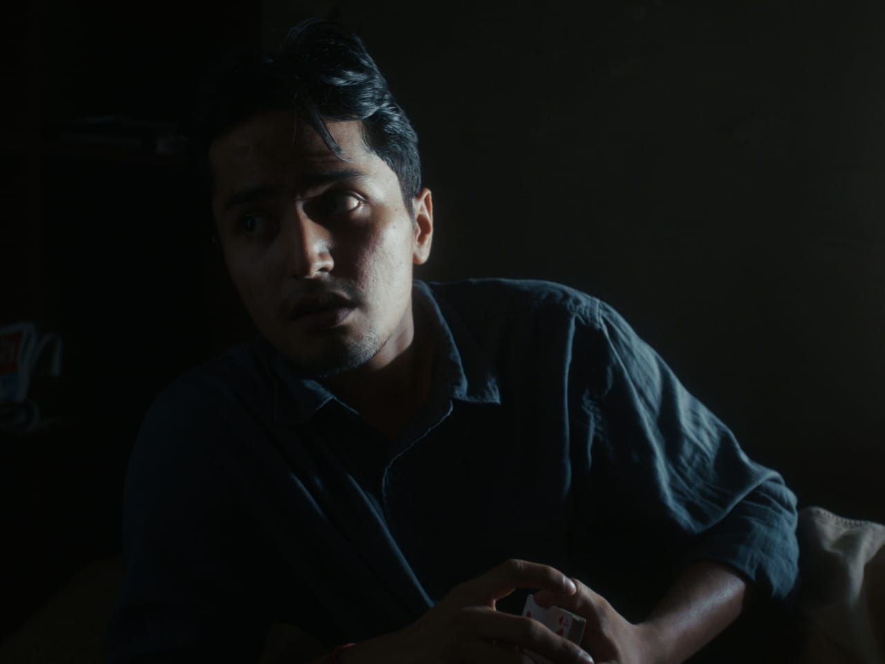 A mise-en-scène exercise still, an actor mid-performance